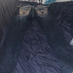 A pair of Miss Me Boot Cut jeans